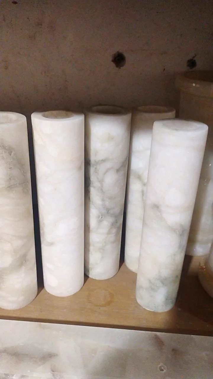 Natural alabaster and marble cylinders in stock