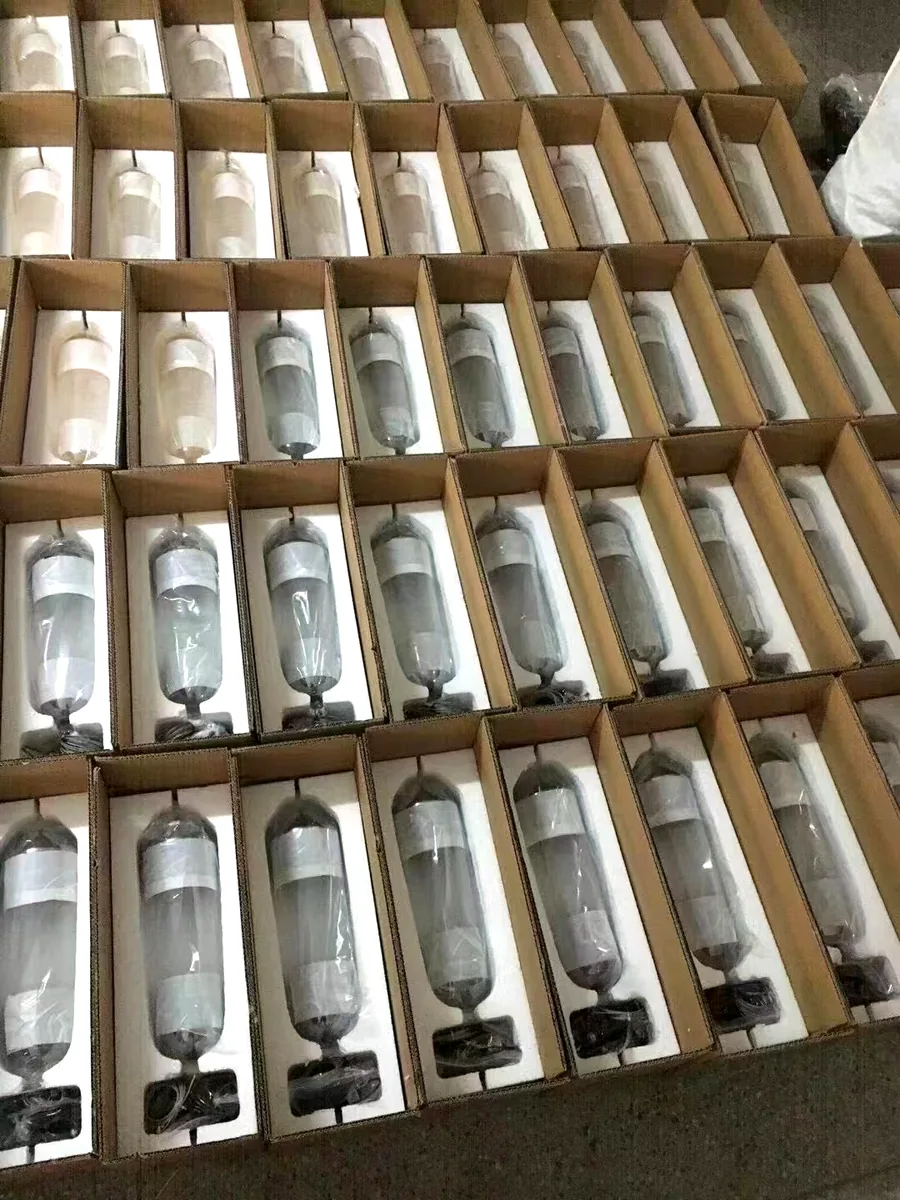 Glass pendant lights packed in individual foam cradles, ready for export