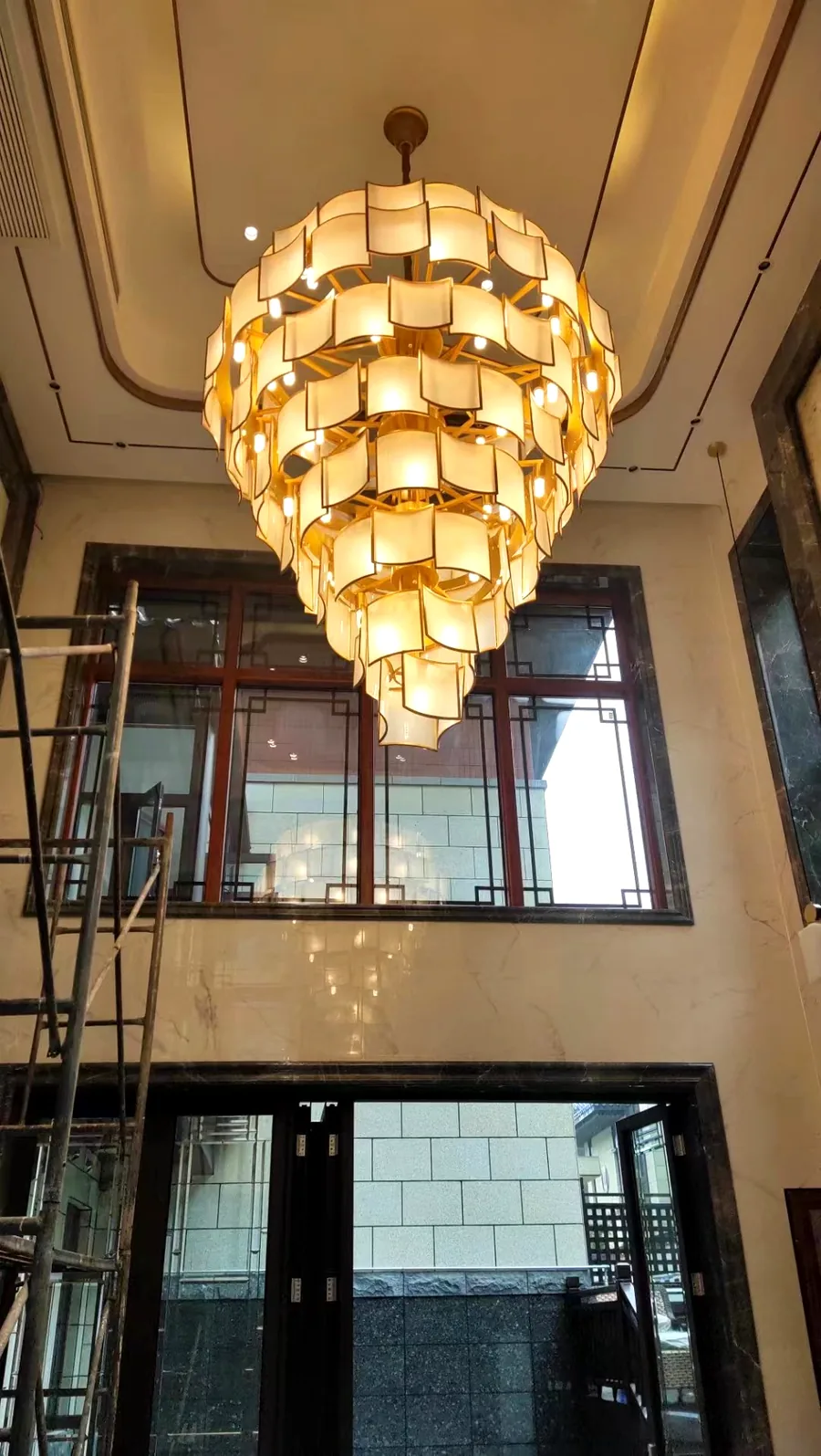 Tiered silk chandelier installed in a double-height villa lobby — custom made by LIEBON LIGHTING